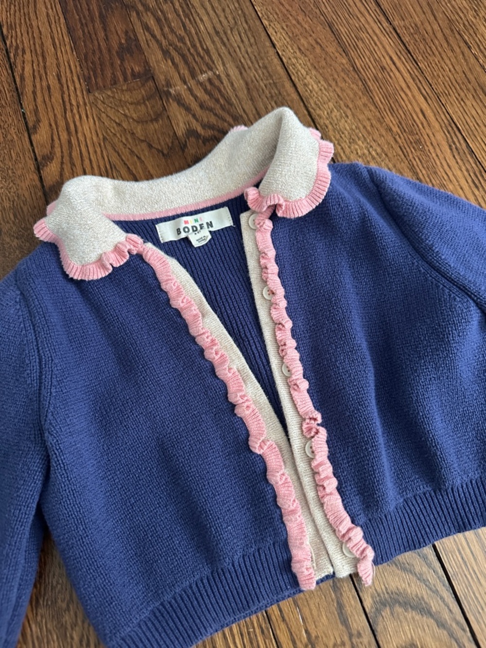 Cropped Boden Navy Cardigan with Pink Ruffle and Gold Cream Collar